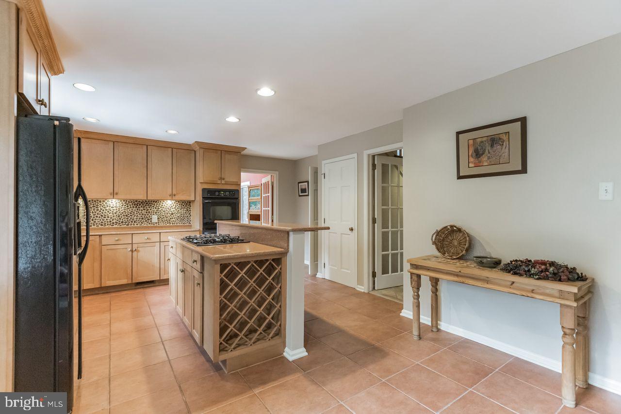 540 Harriton Road Bryn Mawr, PA 19010 - Photo 13 of 35 a kitchen with kitchen island cabinets and counter top space