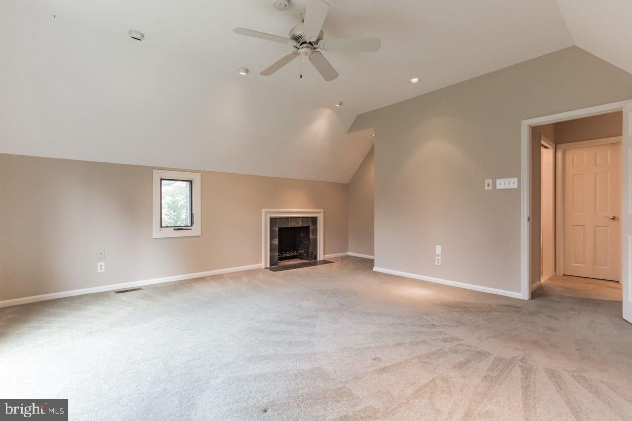 540 Harriton Road Bryn Mawr, PA 19010 - Photo 19 of 35 an empty room with windows and fireplace