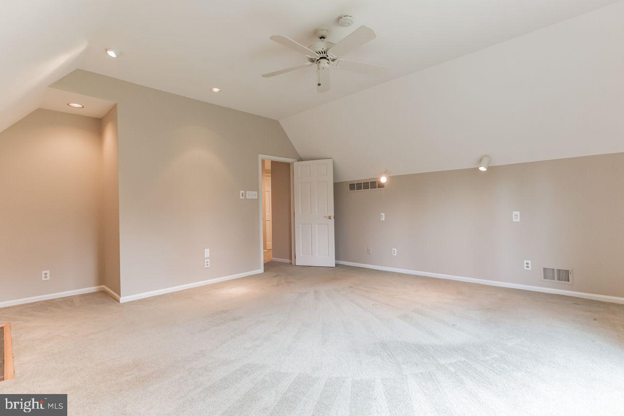 540 Harriton Road Bryn Mawr, PA 19010 - Photo 21 of 35 an empty room with fan and entrance