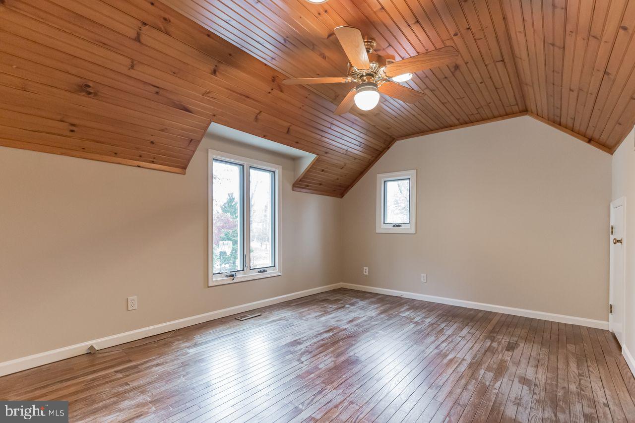 540 Harriton Road Bryn Mawr, PA 19010 - Photo 28 of 35 a view of empty room with window and wooden floor