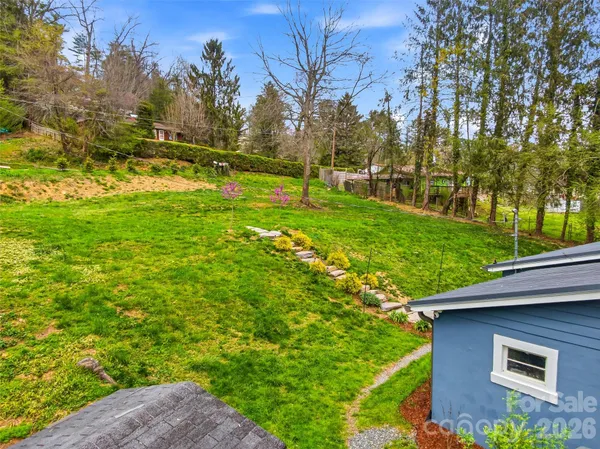 a view of backyard with green space