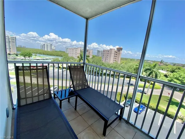 a view of a balcony with furniture