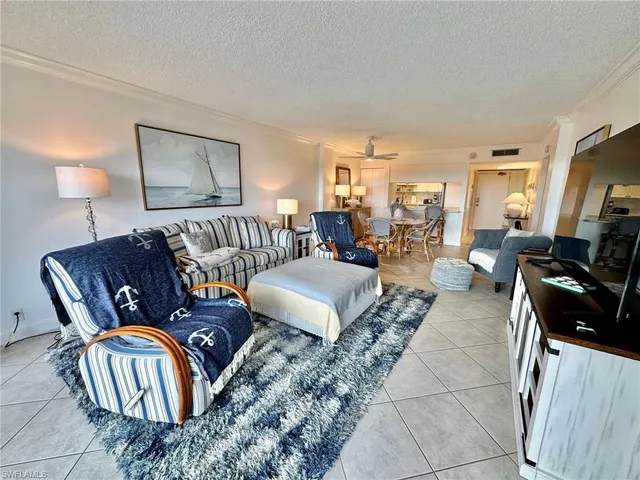 a living room with furniture fireplace and a flat screen tv