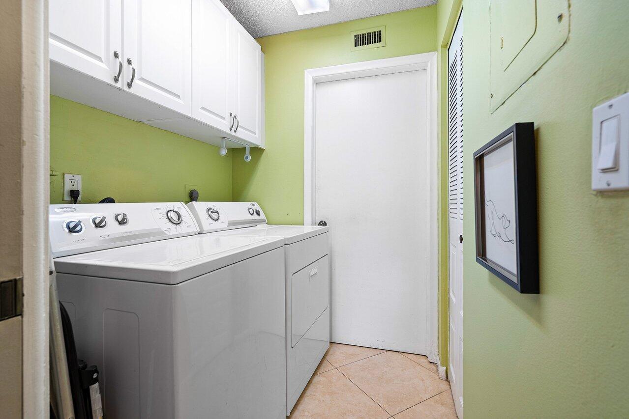 10904 Waterberry Court Boca Raton, FL 33498 - Photo 22 of 37 Laundry + Storage Room