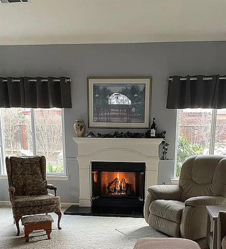 1278 Nelson Boulevard Selma, CA 93662 - Photo 4 of 14 a living room with furniture and a fireplace