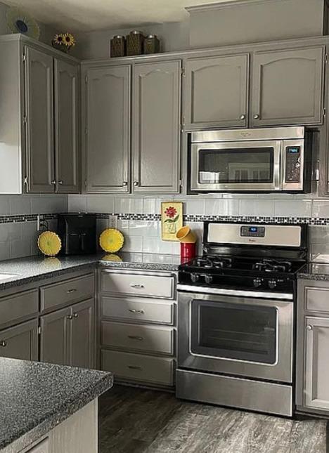1278 Nelson Boulevard Selma, CA 93662 - Photo 6 of 14 a kitchen with stainless steel appliances granite countertop a stove a microwave and cabinets