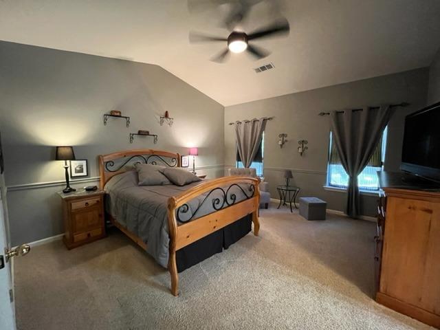 1278 Nelson Boulevard Selma, CA 93662 - Photo 8 of 14 a spacious bedroom with a bed and a flat tv screen on the dresser