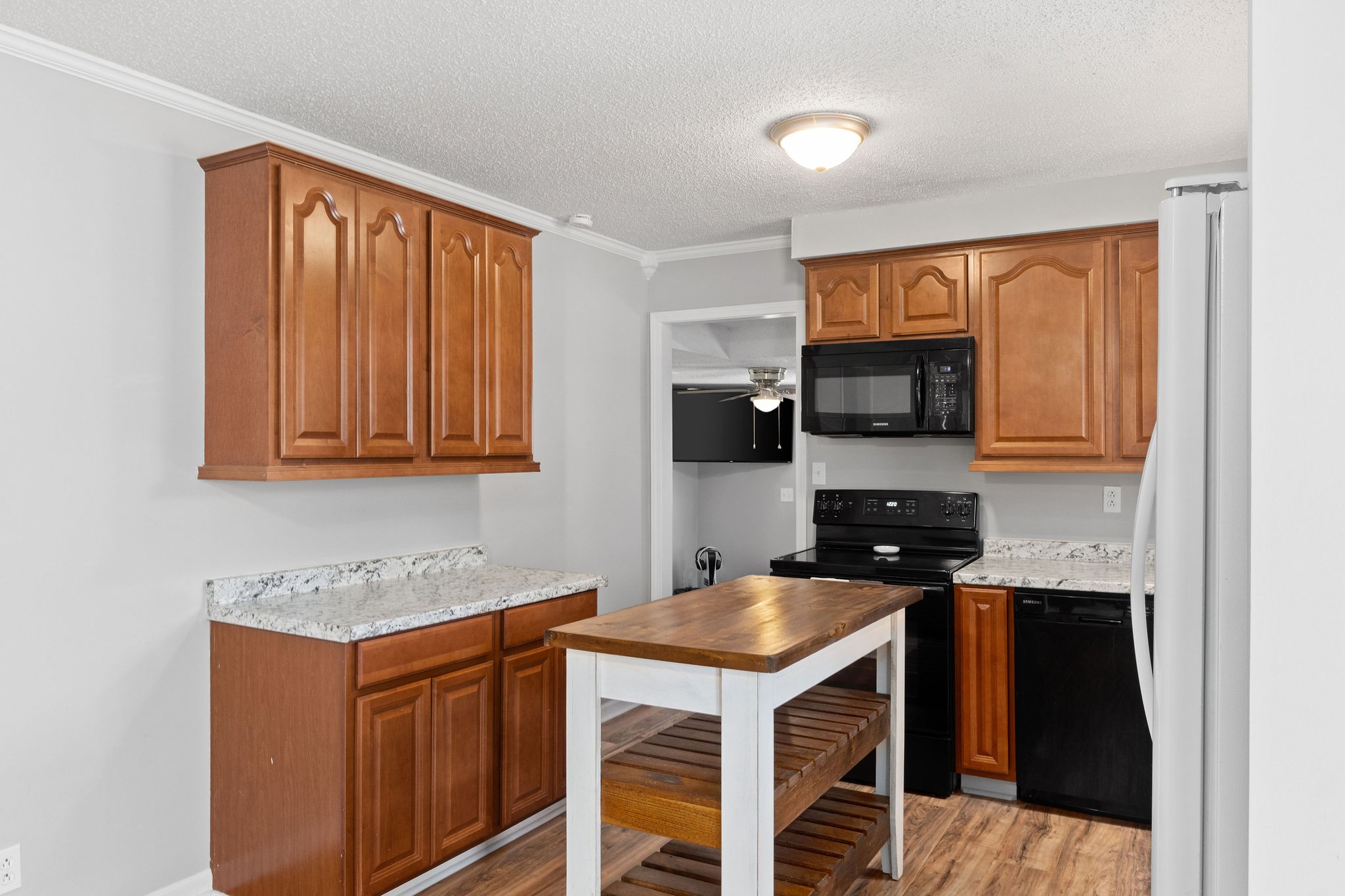 573 Lafayette Road Clarksville, TN 37042 - Photo 11 of 31 a kitchen with stainless steel appliances granite countertop a stove a sink and a microwave