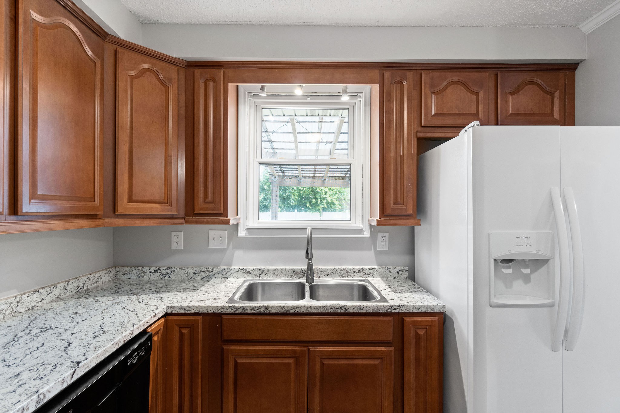 573 Lafayette Road Clarksville, TN 37042 - Photo 13 of 31 a kitchen with a sink cabinets and window