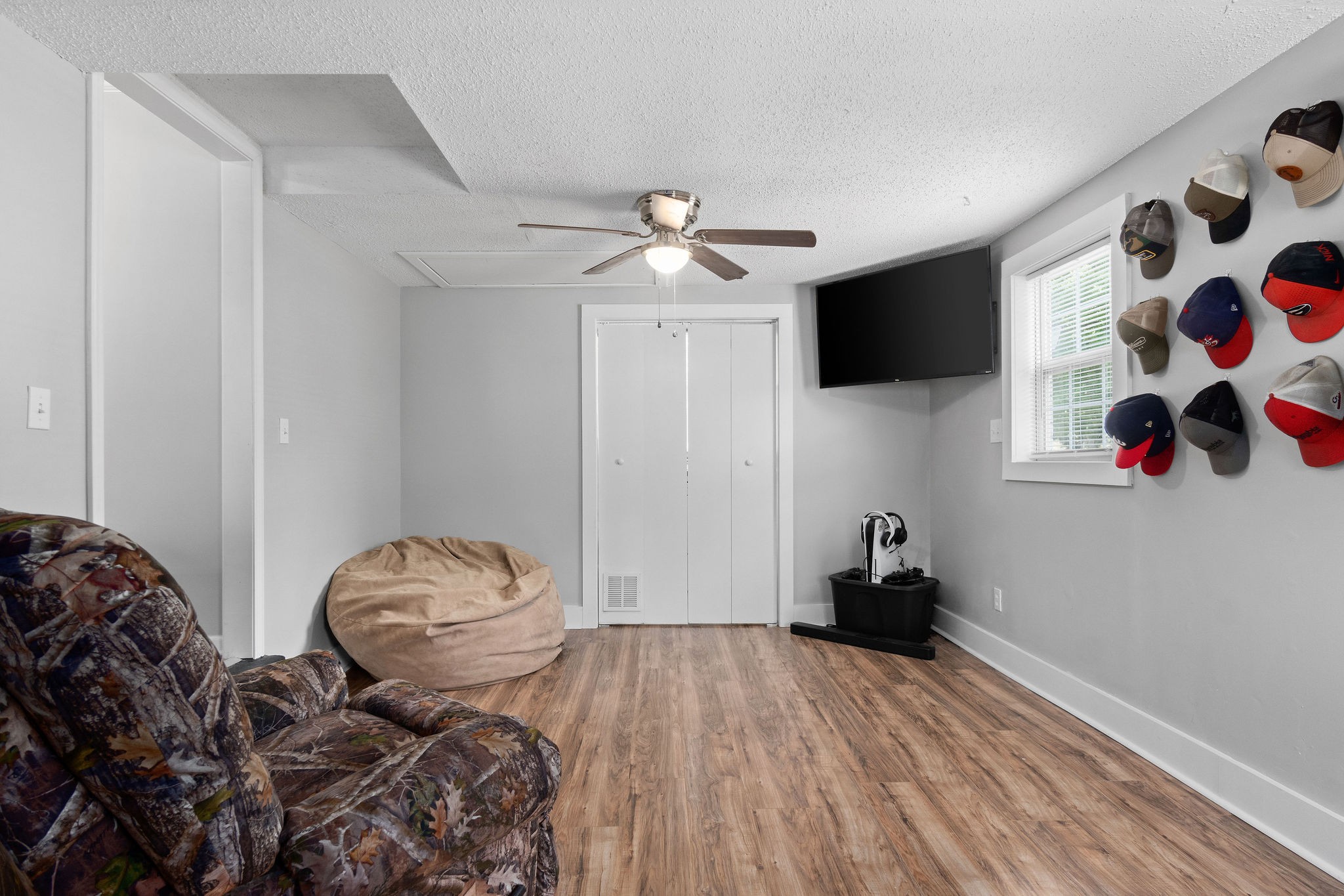 573 Lafayette Road Clarksville, TN 37042 - Photo 14 of 31 a bedroom with a bed and a flat screen tv