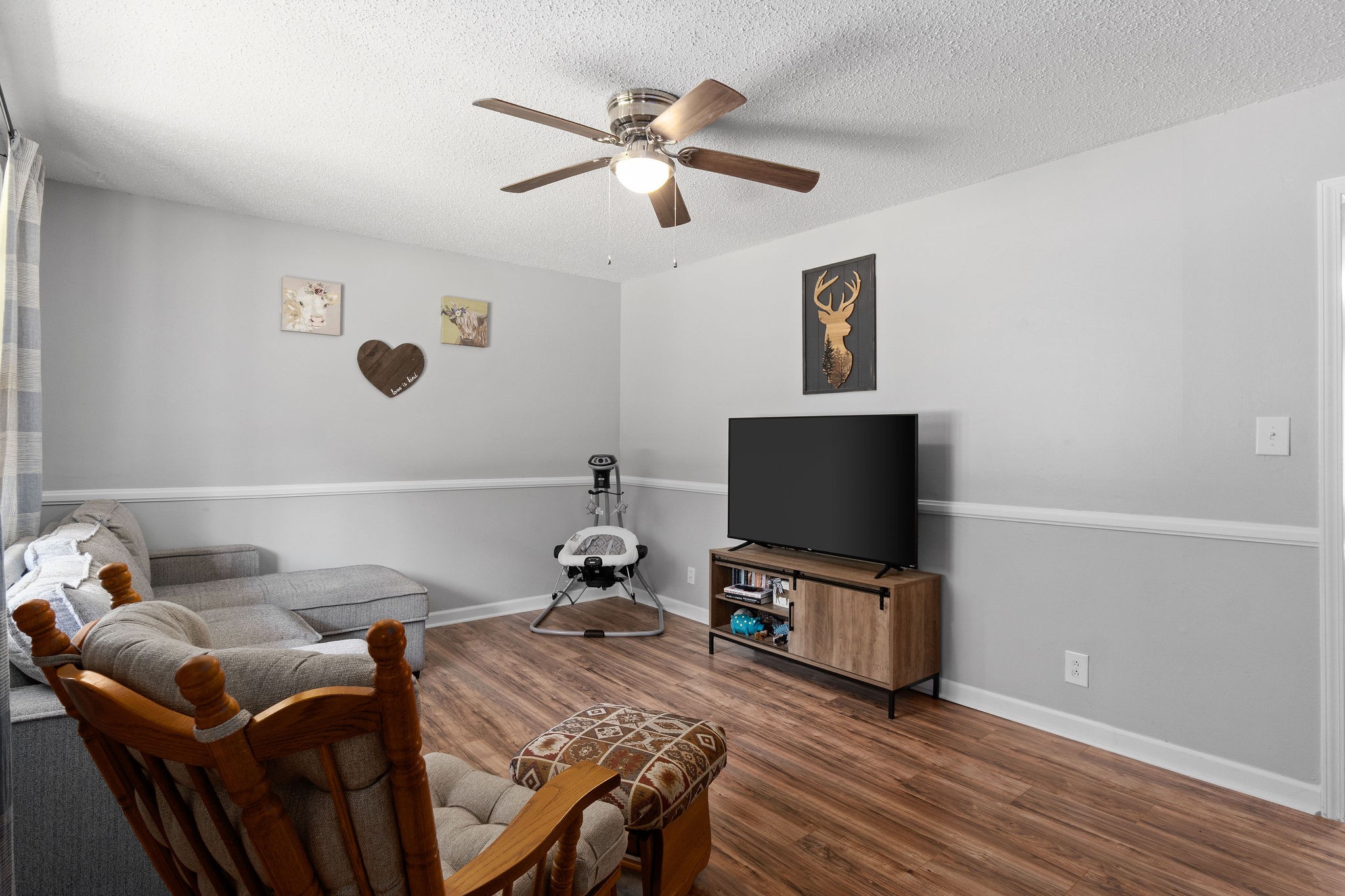 573 Lafayette Road Clarksville, TN 37042 - Photo 4 of 31 a living room with furniture and a flat screen tv