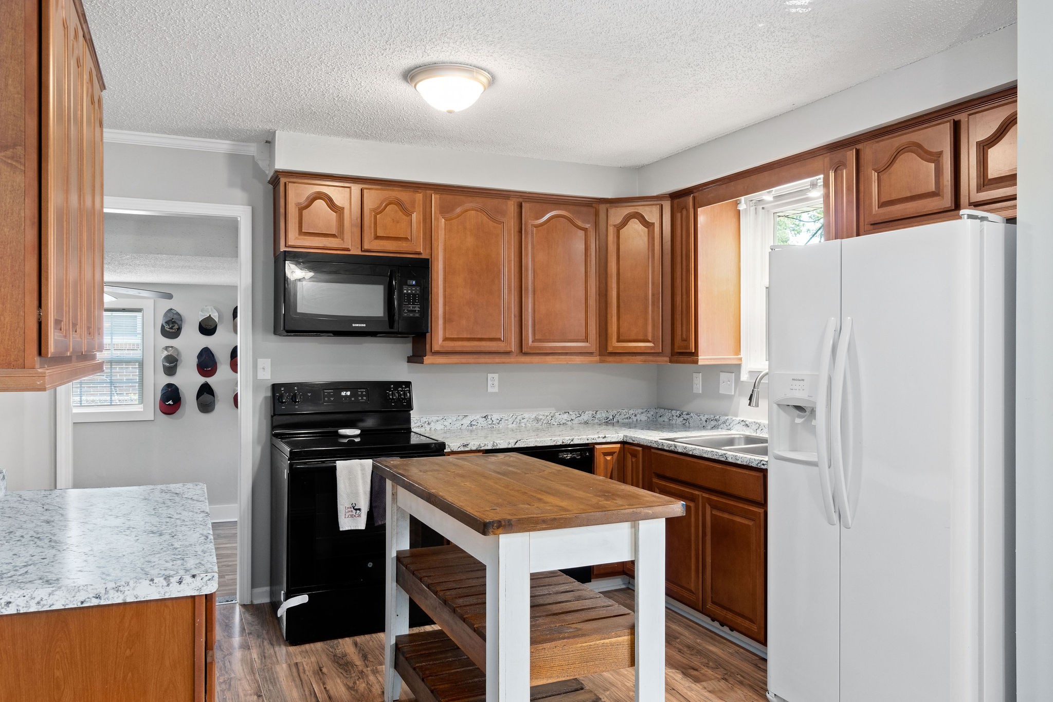 573 Lafayette Road Clarksville, TN 37042 - Photo 10 of 31 a kitchen with a stove a refrigerator and a sink