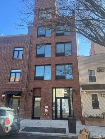 a front view of a multi story residential apartment building