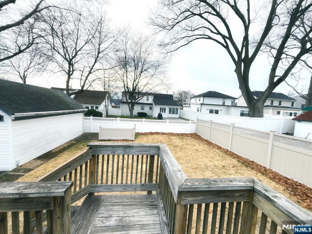 9-04 5th Street Fair Lawn, NJ 07410 - Photo 11 of 17 a view of a swimming pool with a patio