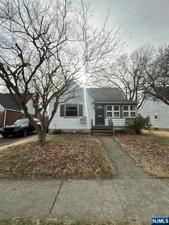 9-04 5th Street Fair Lawn, NJ 07410 - Photo 2 of 17 a front view of a house with a yard