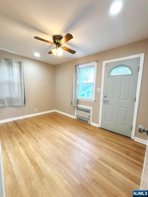 9-04 5th Street Fair Lawn, NJ 07410 - Photo 3 of 17 wooden floor in an empty room with a window