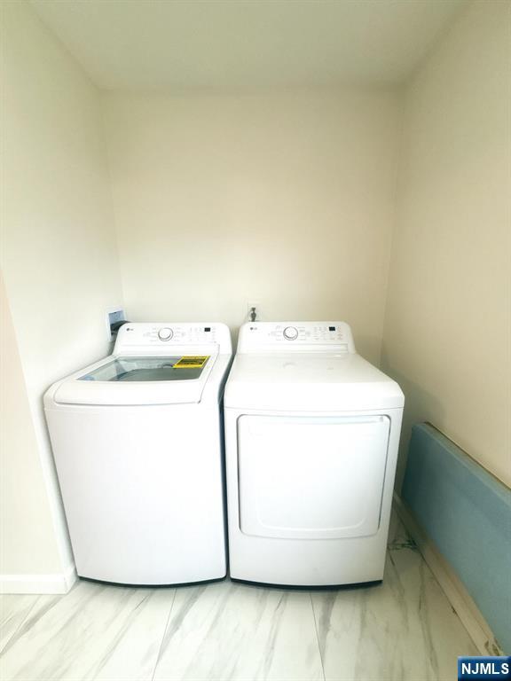 9-04 5th Street Fair Lawn, NJ 07410 - Photo 8 of 17 a utility room with dryer and washer