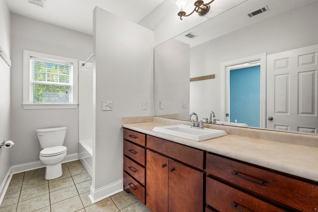 7031 Mellwood Road Columbus, GA 31904 - Photo 8 of 15 a bathroom with a sink and a mirror