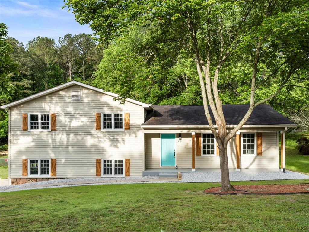 a front view of a house with a yard