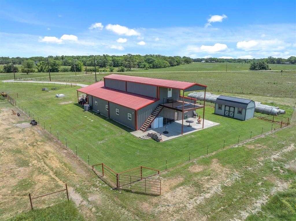 1026 VZ County Road Canton, TX 75103 - Photo 1 of 40 a view of a lake with lawn chairs and a big yard