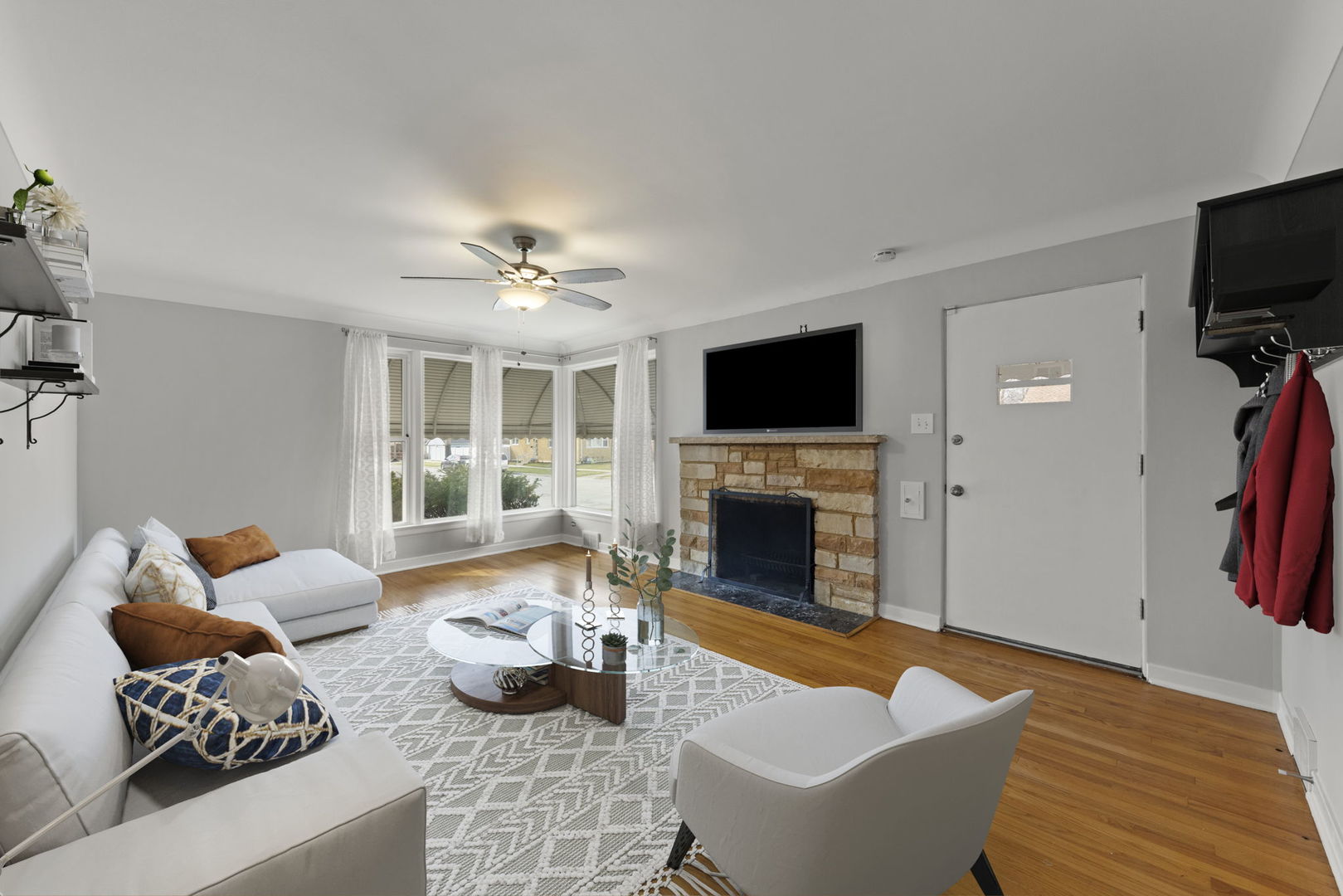 2301 18th Avenue North Riverside, IL 60546 - Photo 4 of 28 a living room with furniture a flat screen tv and a fireplace
