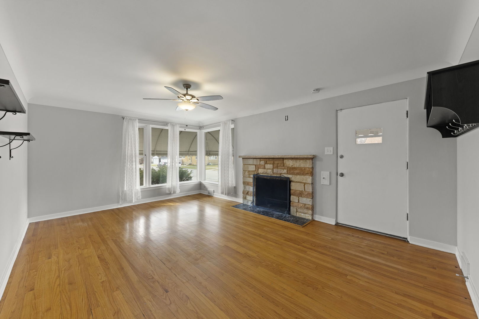 2301 18th Avenue North Riverside, IL 60546 - Photo 5 of 28 a view of an empty room with wooden floor and a fireplace
