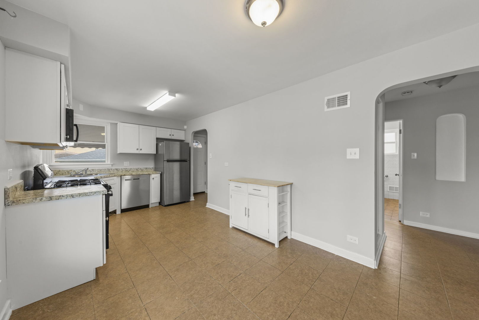 2301 18th Avenue North Riverside, IL 60546 - Photo 9 of 28 a view of kitchen with stainless steel appliances granite countertop refrigerator sink and stove