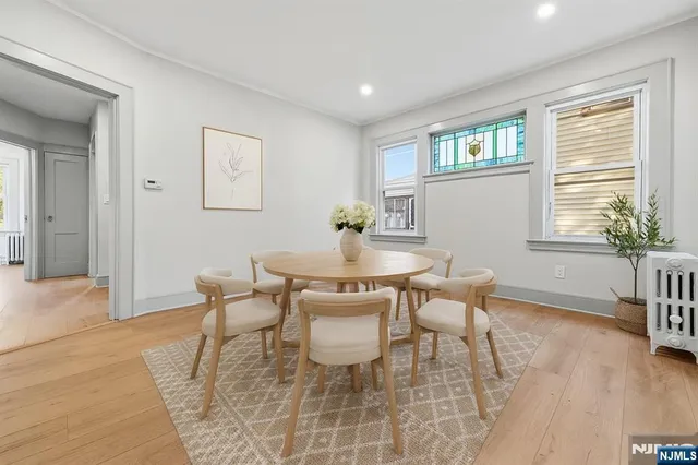 a dining room with furniture and window