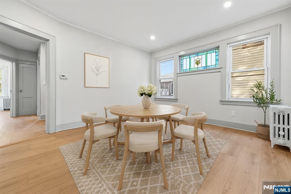a dining room with furniture and window