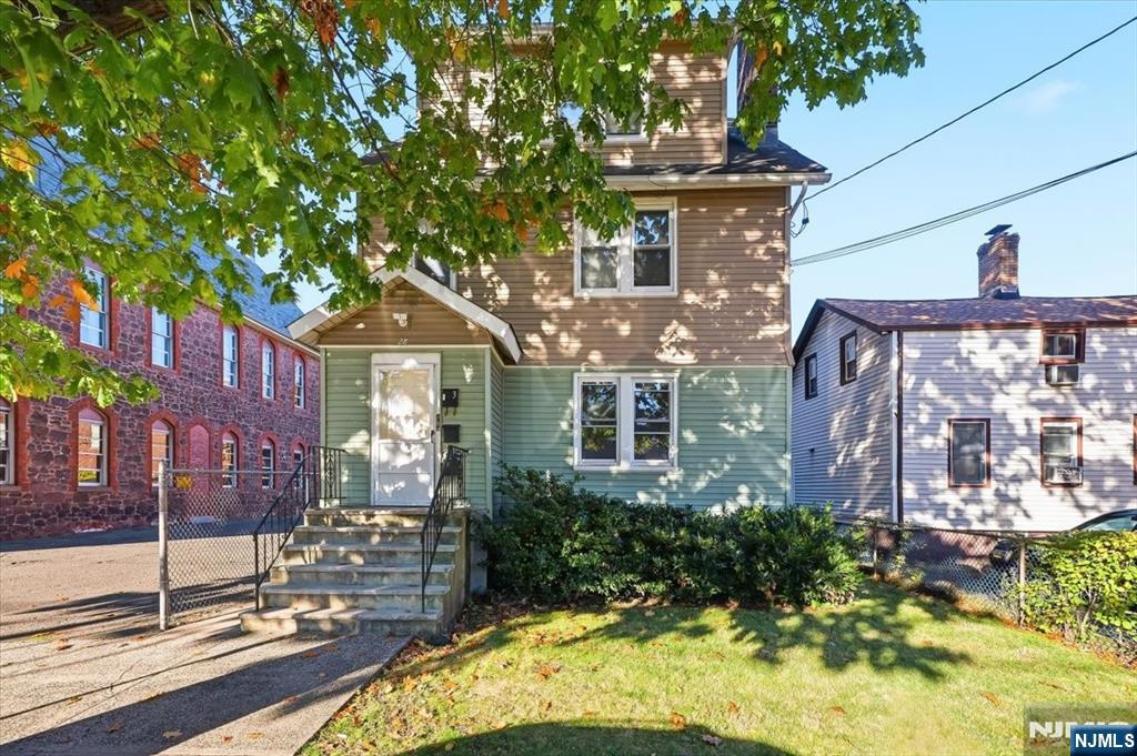 28 State Street, Unit 1 Bloomfield, NJ 07003 - Photo 7 of 8 a front view of a house with a yard