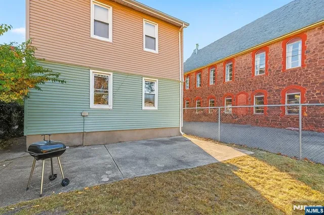 a view of a backyard with a sitting area