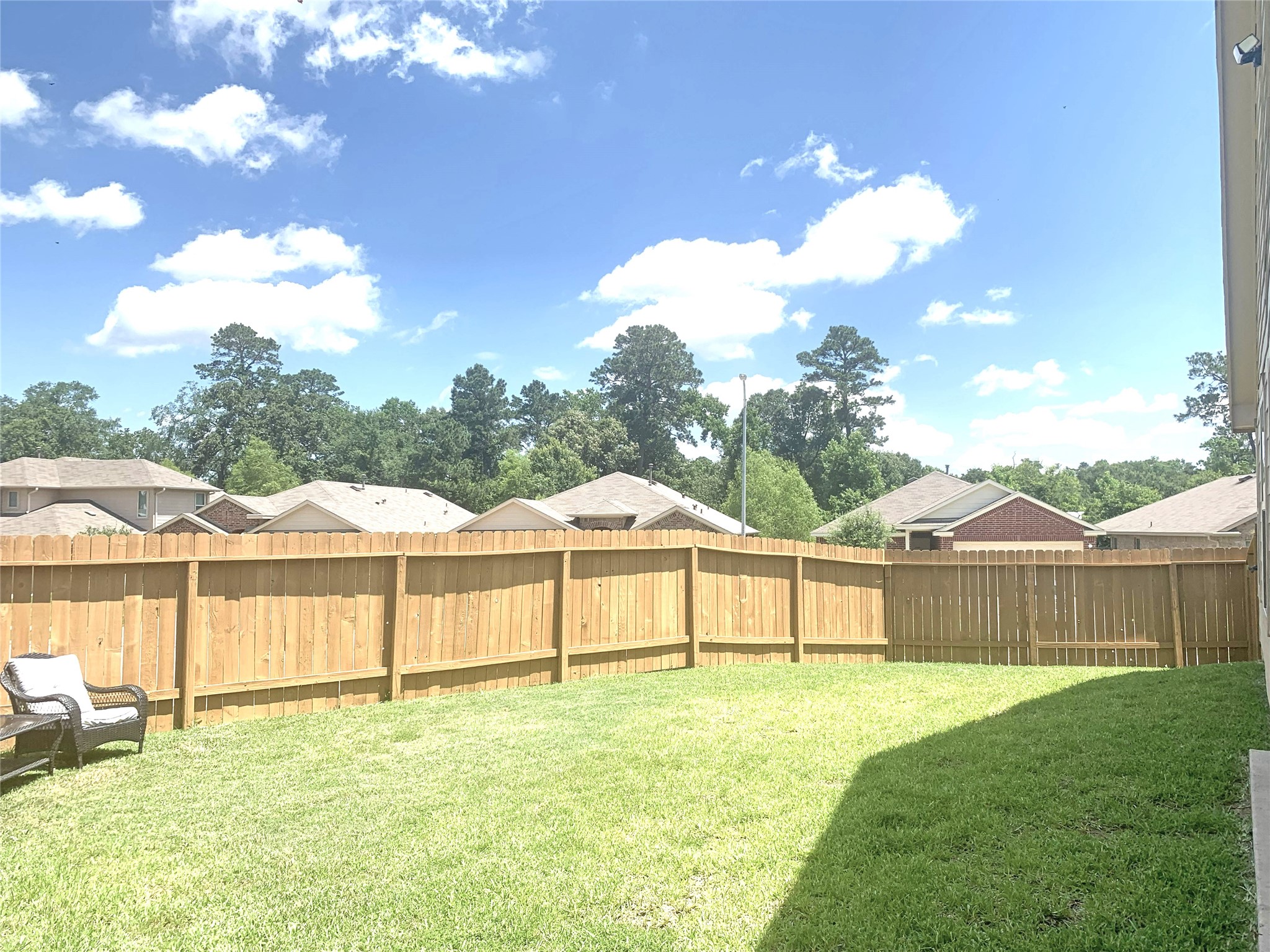 5612 Rainflower Terrace Lane Spring, TX 77389 - Photo 39 of 50 a view of a white house with a big yard and large trees