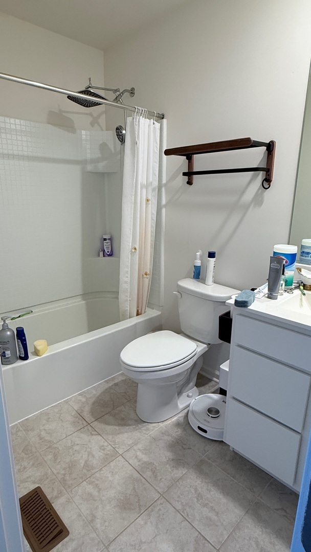 2008 Yellowstone Boulevard, Unit 2008 Mundelein, IL 60060 - Photo 16 of 25 a bathroom with a sink toilet and shower