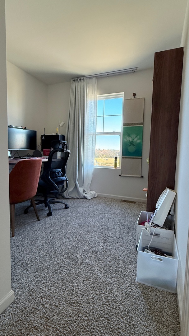 2008 Yellowstone Boulevard, Unit 2008 Mundelein, IL 60060 - Photo 17 of 25 a living room with furniture and a window