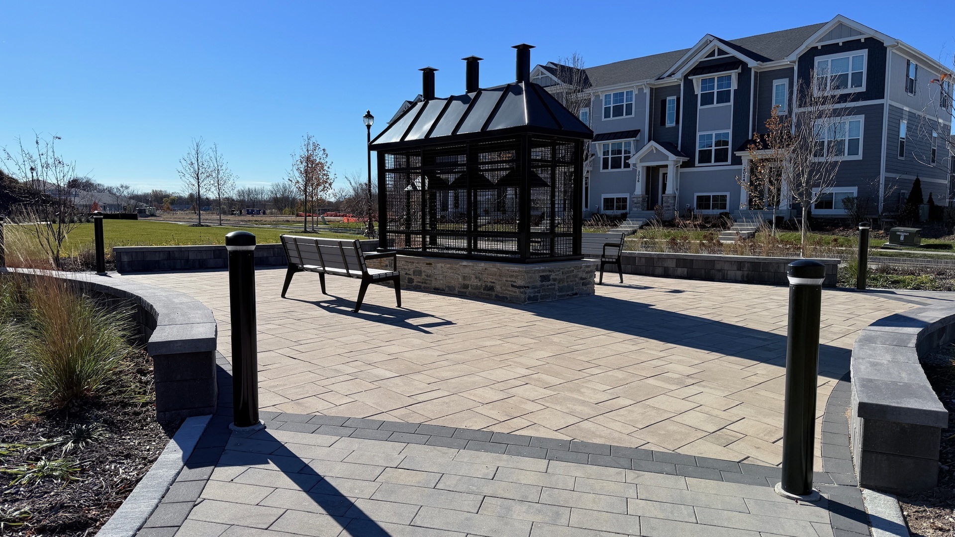 2008 Yellowstone Boulevard, Unit 2008 Mundelein, IL 60060 - Photo 24 of 25 a view of a brick building with a bench in front of building