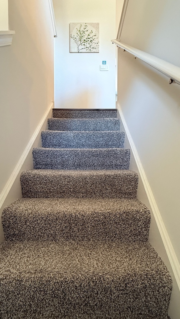 2008 Yellowstone Boulevard, Unit 2008 Mundelein, IL 60060 - Photo 4 of 25 a view of staircase with white walls