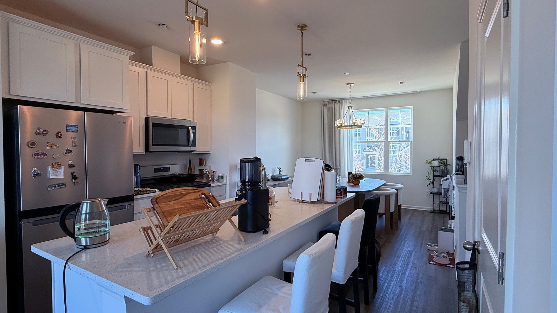 2008 Yellowstone Boulevard, Unit 2008 Mundelein, IL 60060 - Photo 7 of 25 a dining room with furniture a window and appliances
