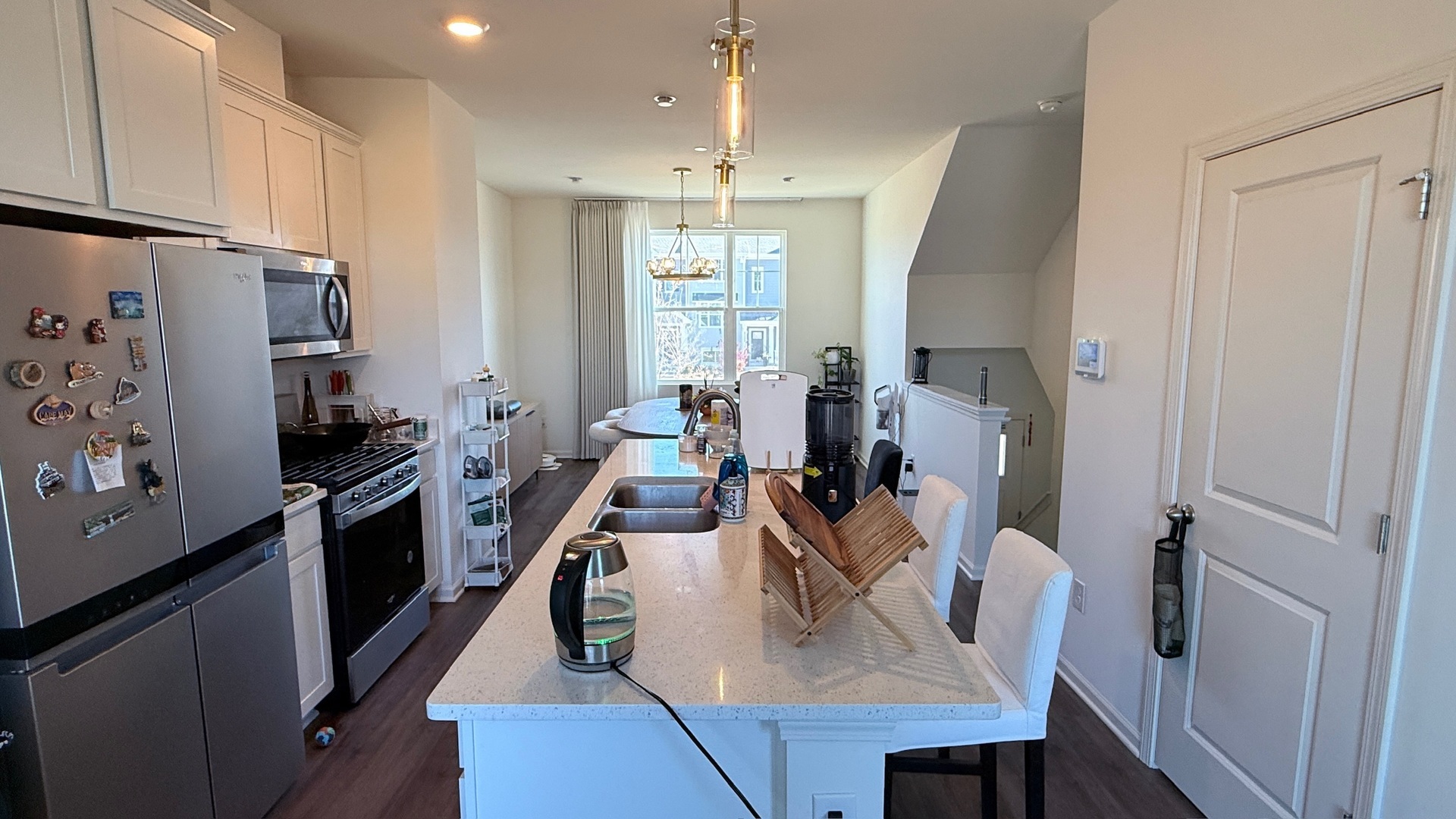 2008 Yellowstone Boulevard, Unit 2008 Mundelein, IL 60060 - Photo 8 of 25 a kitchen with refrigerator cabinets and wooden floor