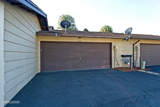 a front view of a house with a garage