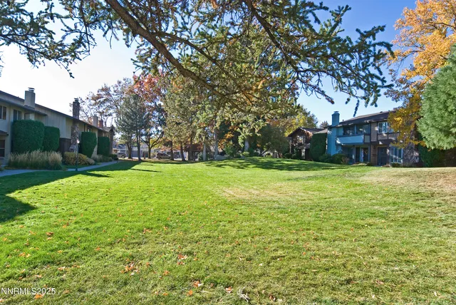 a view of a garden with a house