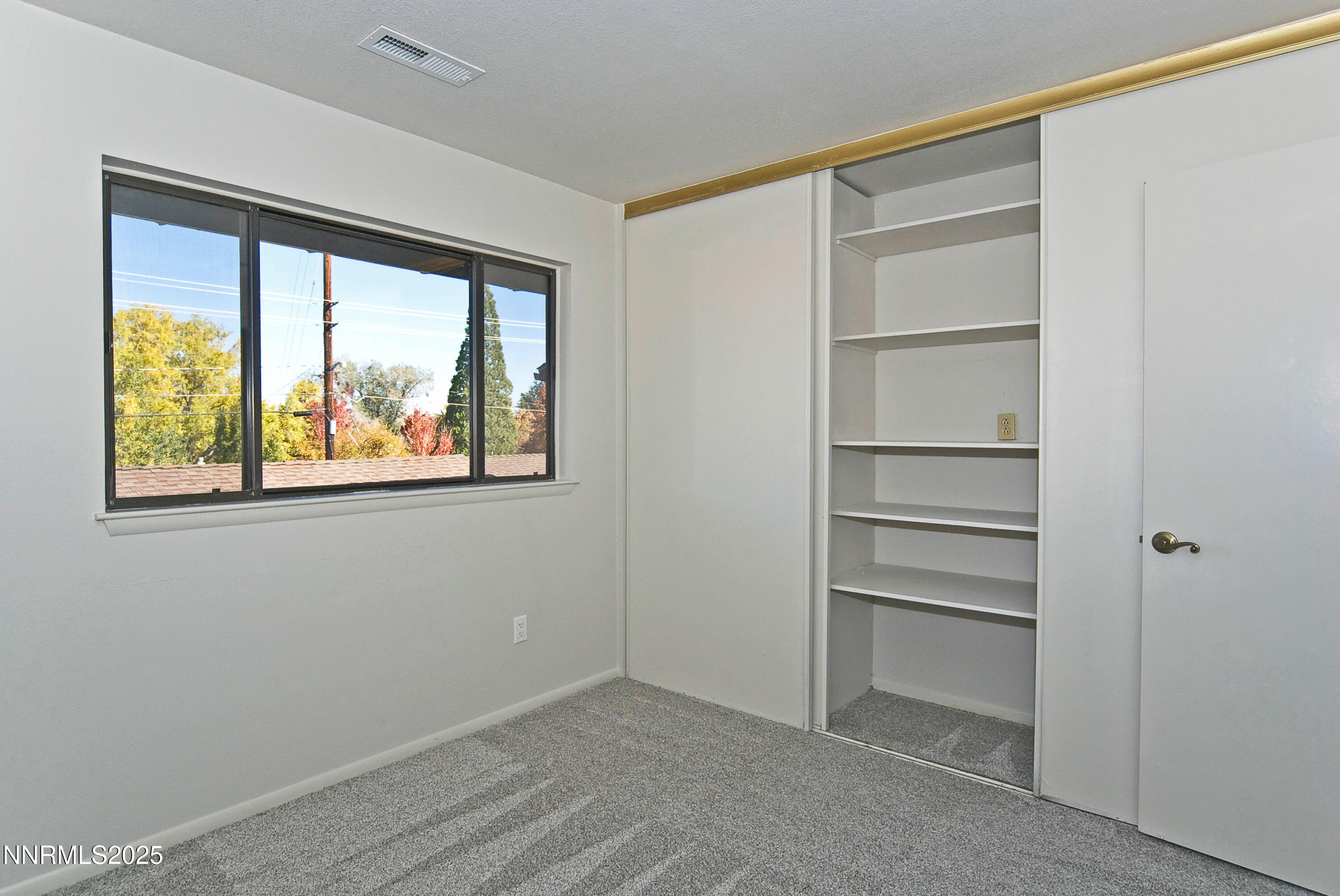1433 Foster Drive Reno, NV 89509 - Photo 21 of 23 a view of an empty room with a window