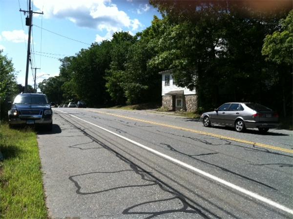 108 Thompson Road Webster, MA 01570 - Photo 5 of 5 a car parked on the side of a road