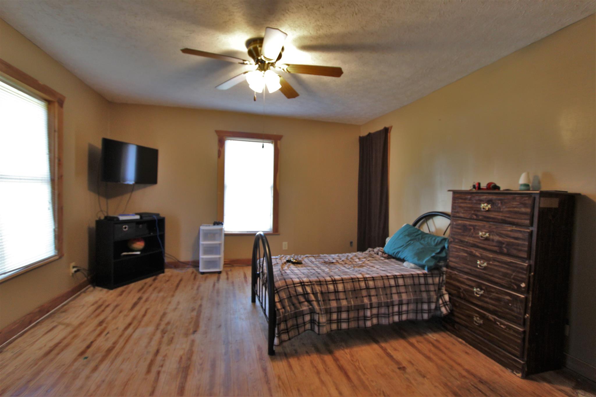 2296 Tracy Road Watertown, TN 37184 - Photo 13 of 29 a bedroom with a bed and wooden floor