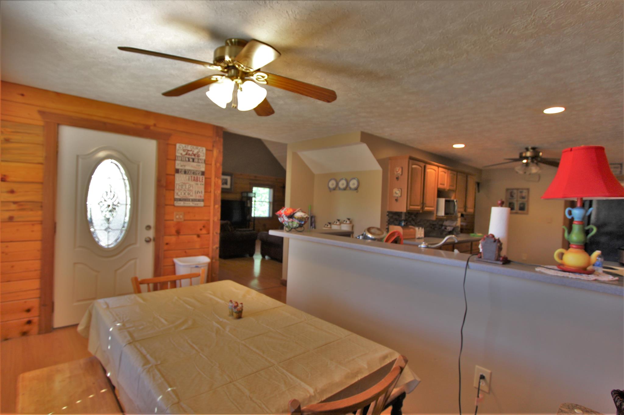 2296 Tracy Road Watertown, TN 37184 - Photo 22 of 29 a living room with furniture a chandelier and a large window