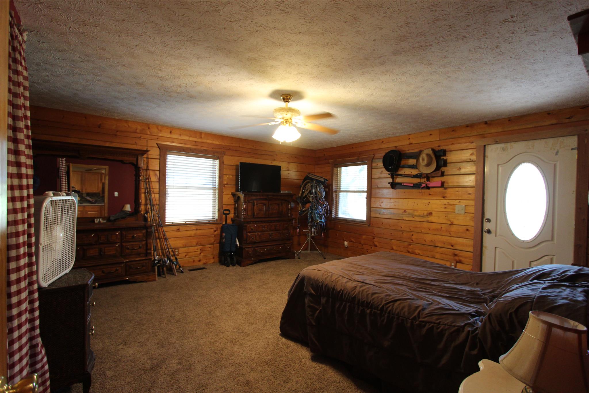 2296 Tracy Road Watertown, TN 37184 - Photo 8 of 29 a spacious bedroom with a bed and a chandelier