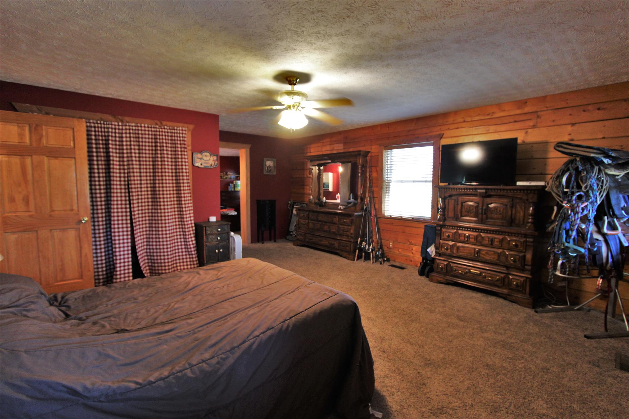 2296 Tracy Road Watertown, TN 37184 - Photo 10 of 29 a bedroom with a bed and a walk in closet