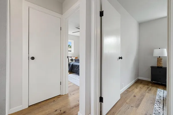 a view of a room with wooden floor