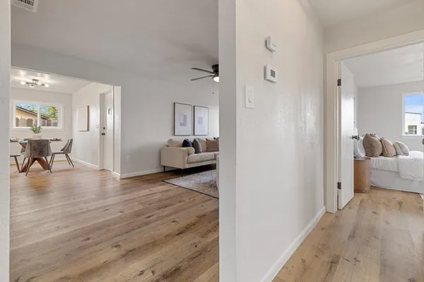 a view of a livingroom with furniture and wooden floor
