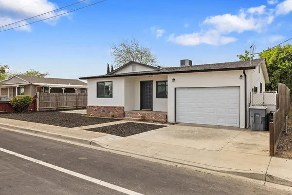a front view of a house with a garage