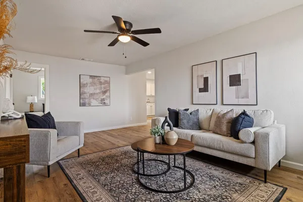 a living room with furniture and a rug